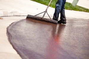 Road Worker Resurfacing Street