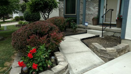 When should you replace old concrete instead of installing a surface patch