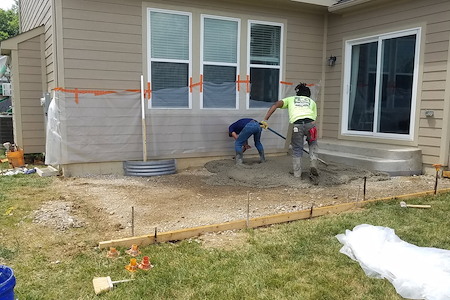Why is proper site preparation so important before concrete installation
